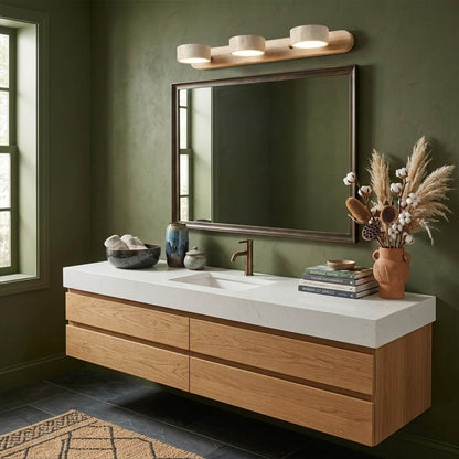 Saffron travertine vanity light above bathroom mirror warm stone glow modern interior
