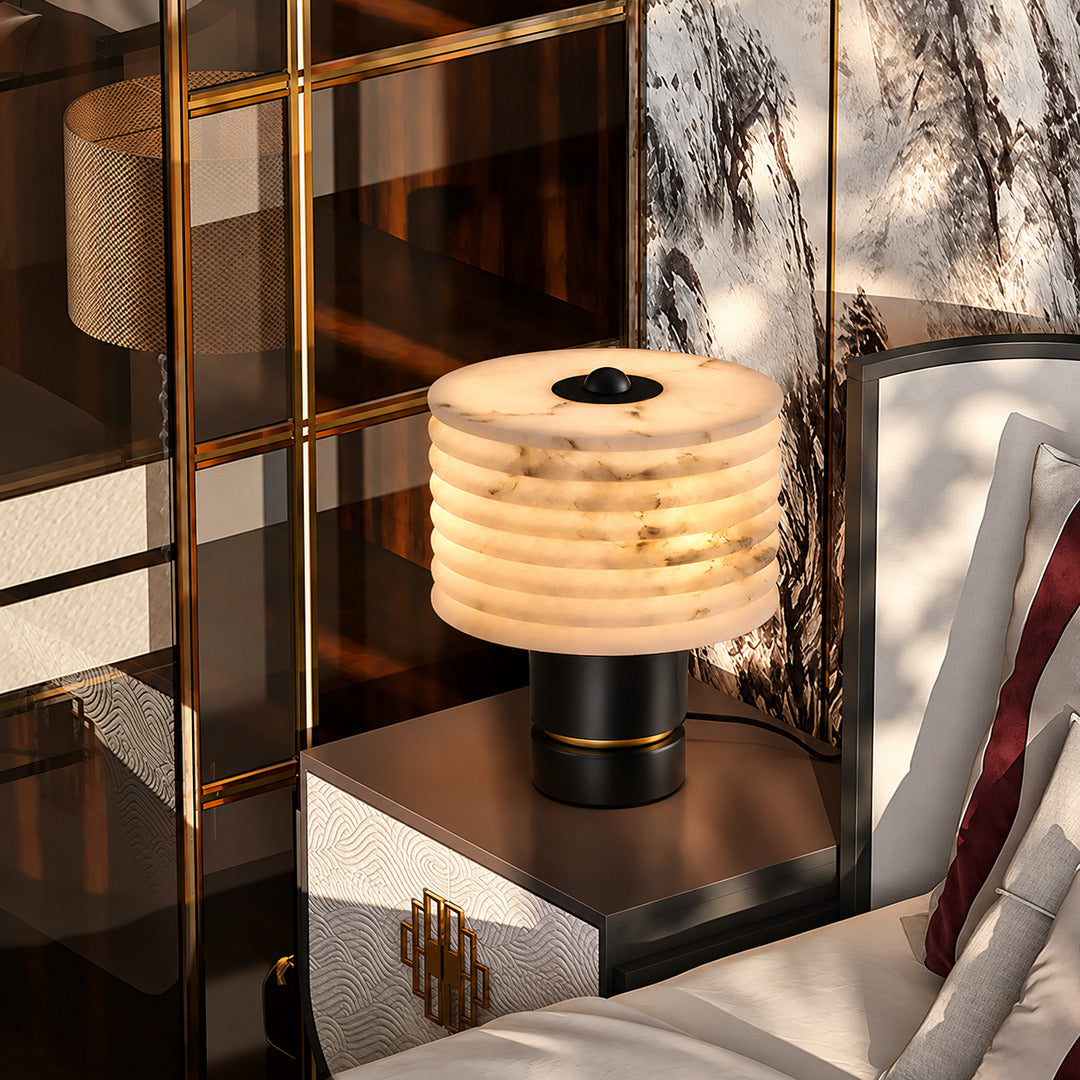 Pair of Sasso table lamps on nightstands flanking a bed