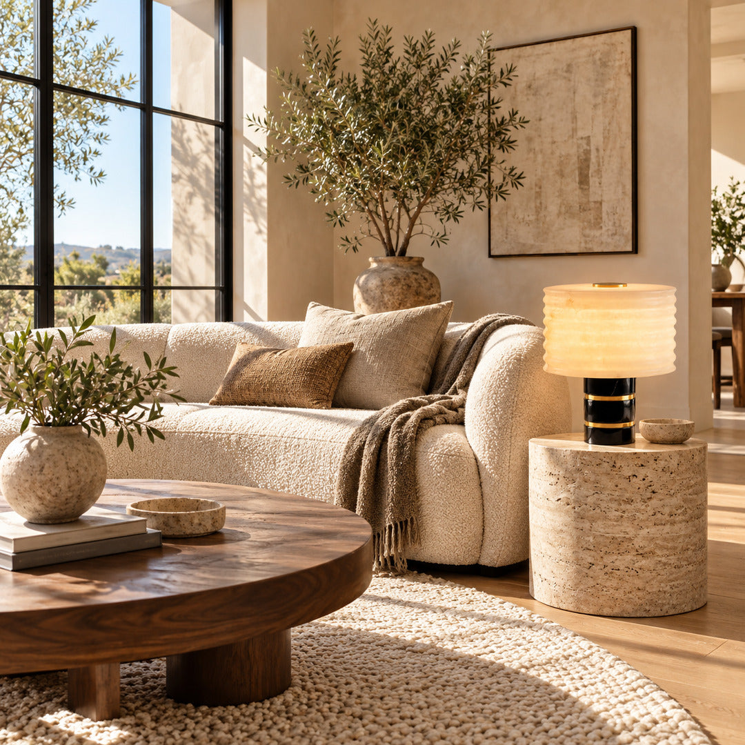 Sasso table lamp on a side table next to a living room sofa