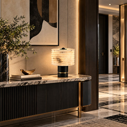 Sasso table lamp on a side table next to a living room sofa