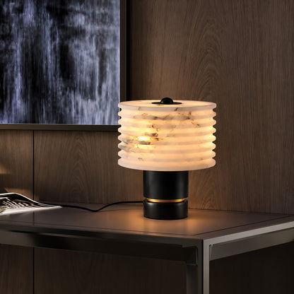 Sasso table lamp adding ambient light to a home office desk