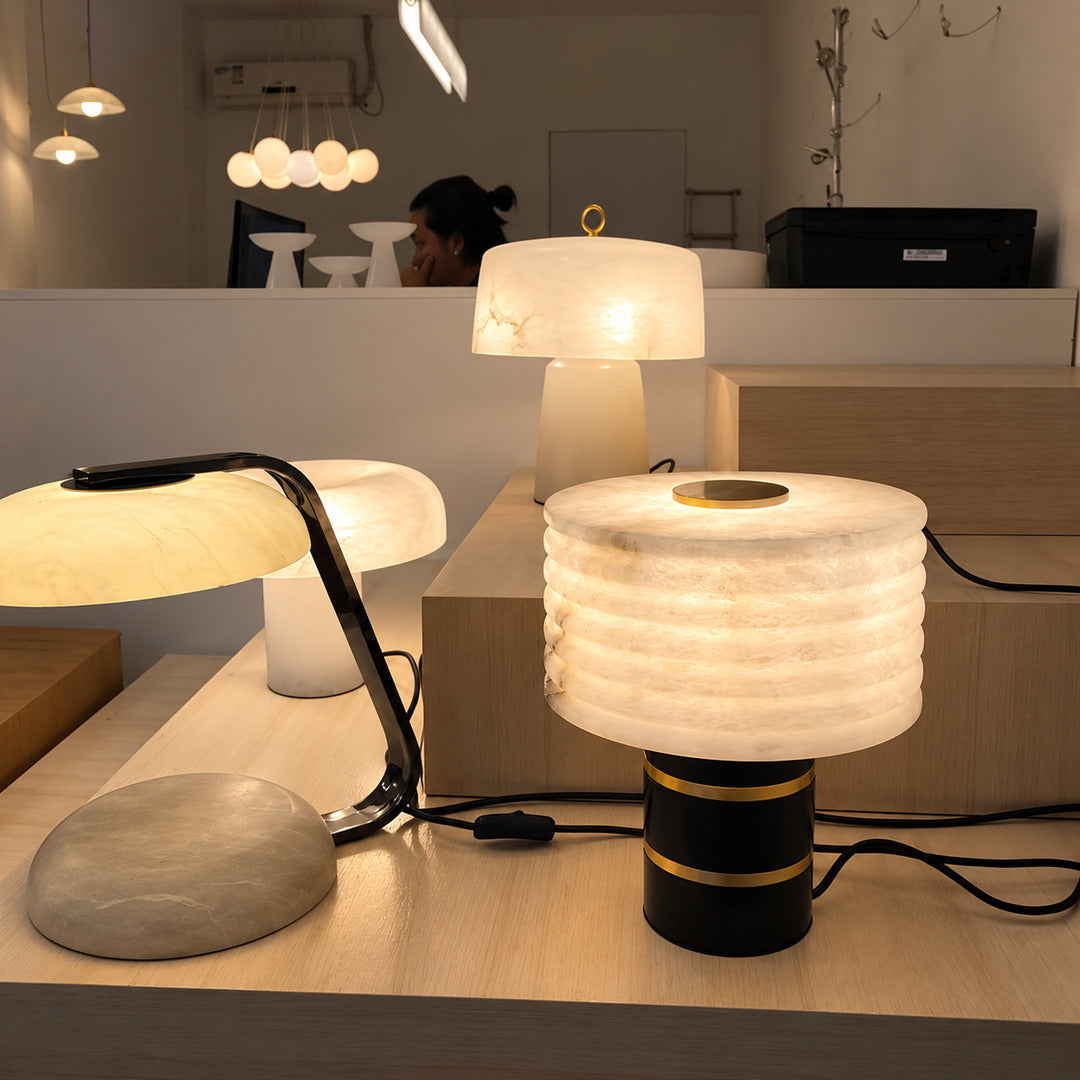 Sasso table lamp adding ambient light to a home office desk