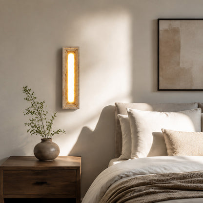 Sasso travertine wall sconce bedroom bedside warm glow natural travertine stone column minimalist American home lifestyle interior styled