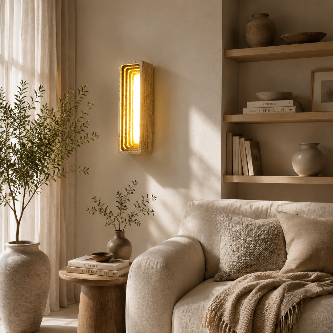 Sasso travertine wall sconce living room wall warm glow travertine stone column sculptural American home lifestyle interior styled