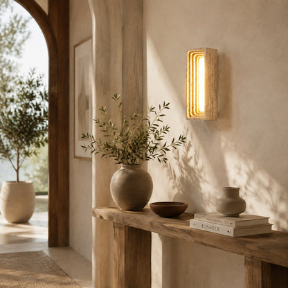 Sasso travertine wall sconce entryway foyer warm glow travertine stone column walnut American home lifestyle interior styled