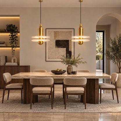 Row of single-disc Saturno alabaster pendants suspended over a modern kitchen island