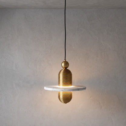 Single-disc 7.1-inch gold Saturno alabaster pendant over a kitchen island or bedside