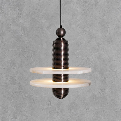 Single-disc 11-inch black Saturno alabaster pendant over a round dining table
