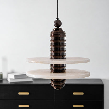Detail of the ribbed metal column and sphere top of the Saturno alabaster pendant