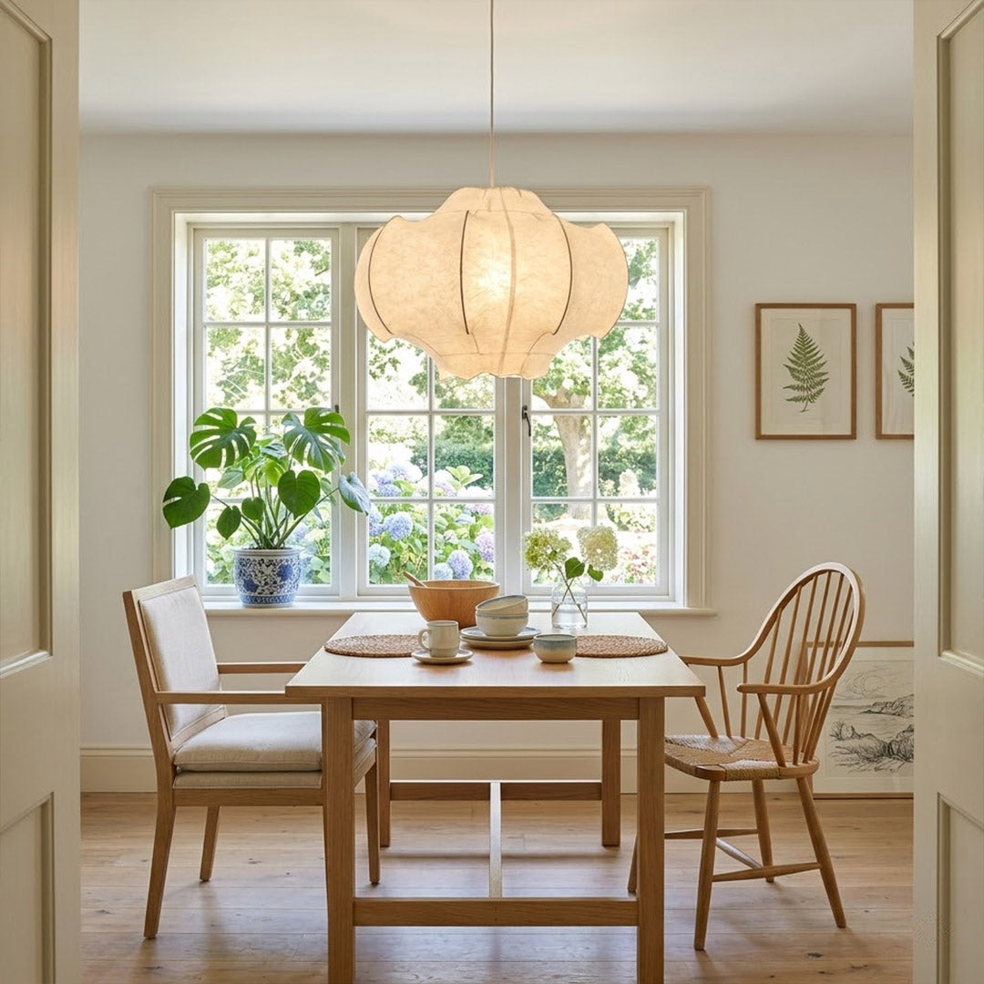 Saya 23 inch double light silk lotus pendant above modern dining table six seat warm intimate glow Zen aesthetic