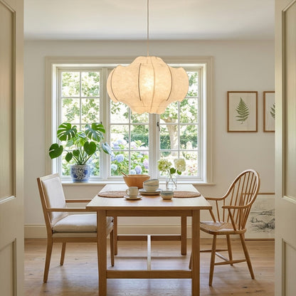 Saya 23 inch double light silk lotus pendant above modern dining table six seat warm intimate glow Zen aesthetic