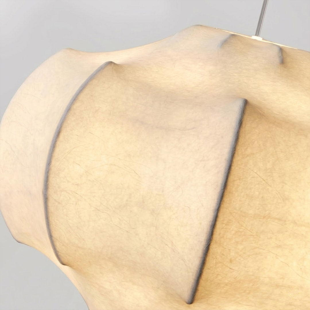 Saya silk pendant illuminated close up warm amber glow translucent ivory silk shade lantern light from within detail
