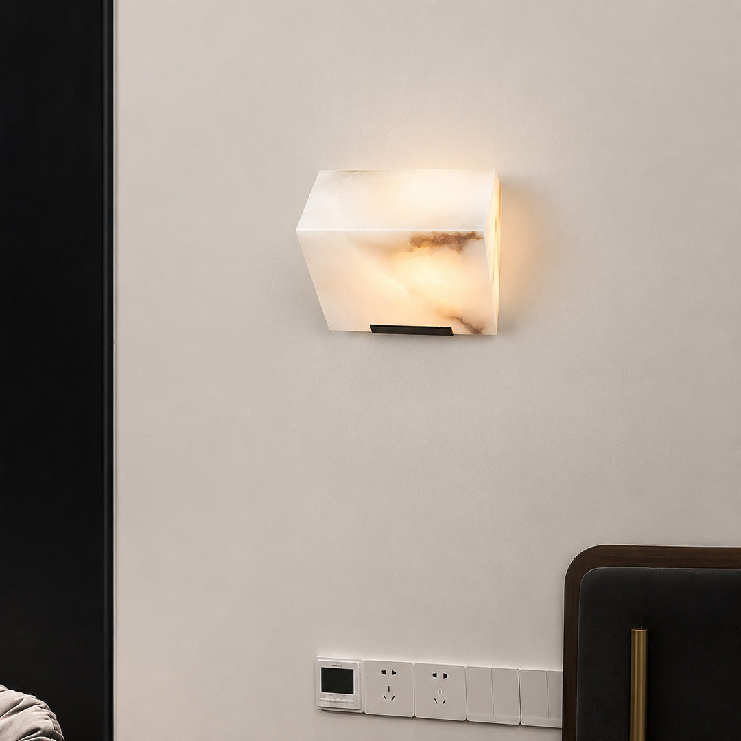 Natural veining and translucency of an alabaster panel on the Scala wall sconce, unique to each piece
