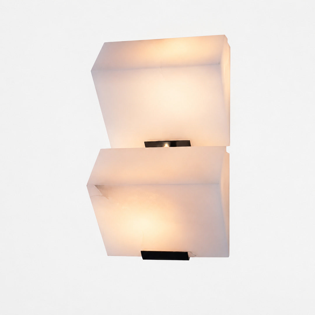 Two-panel Scala alabaster wall sconce with a stepped glow on a hallway wall