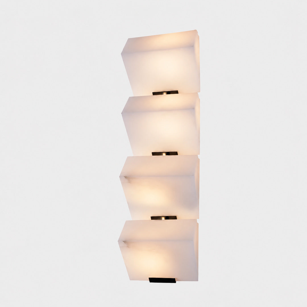 Three-panel Scala alabaster wall sconce as a sculptural stepped accent on a staircase wall