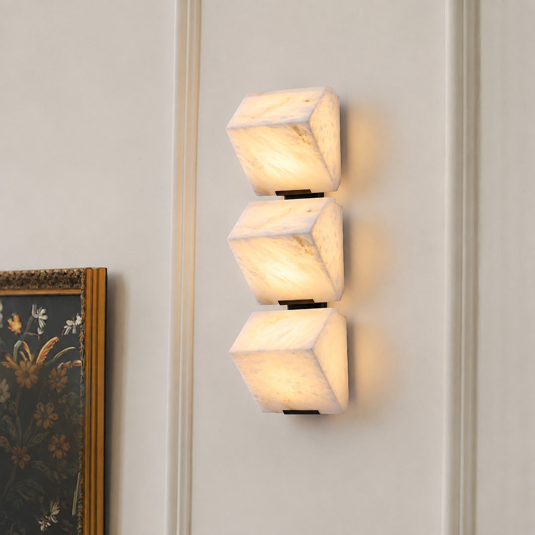 Scala alabaster wall sconce as a warm sculptural accent on a modern living room feature wall