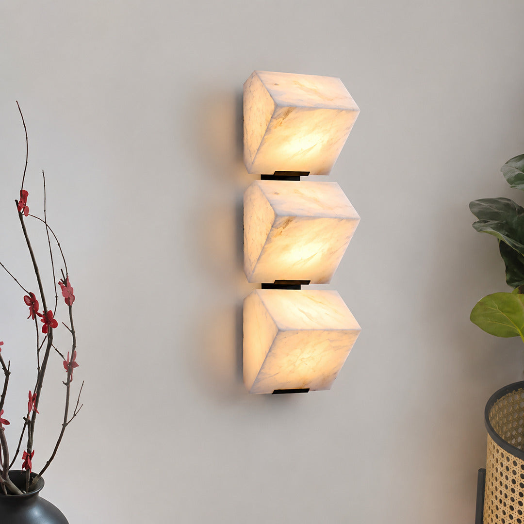 Scala alabaster wall sconce as a warm sculptural accent on a modern living room feature wall
