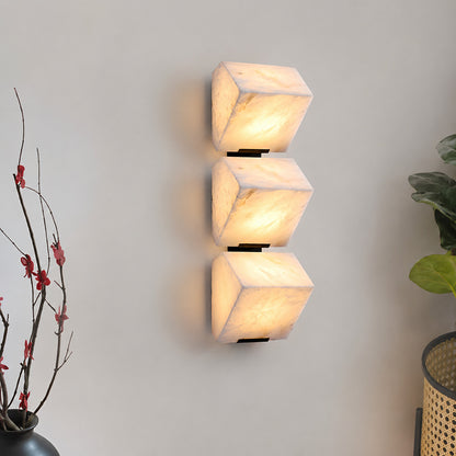Scala alabaster wall sconce as a warm sculptural accent on a modern living room feature wall