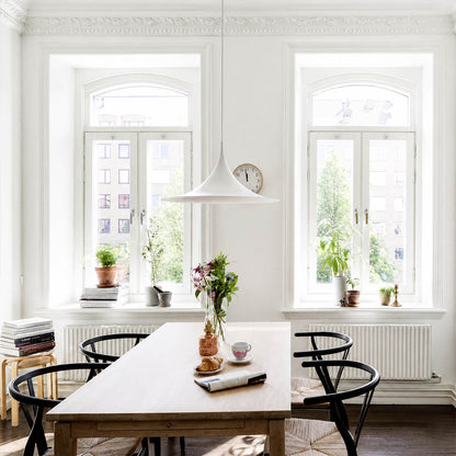Semi pendant light black modern kitchen island triple cluster row hanging Danish 1968 modernist icon farmhouse contemporary sophisticated cozy American home lifestyle interior