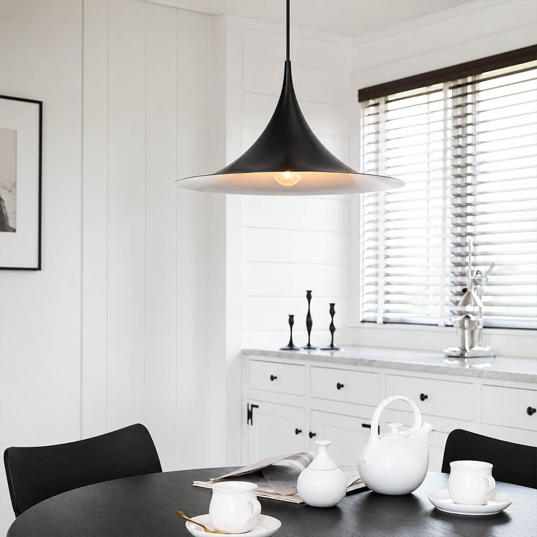Semi pendant light black modern kitchen island triple cluster row hanging Danish 1968 modernist icon farmhouse contemporary sophisticated cozy American home lifestyle interior