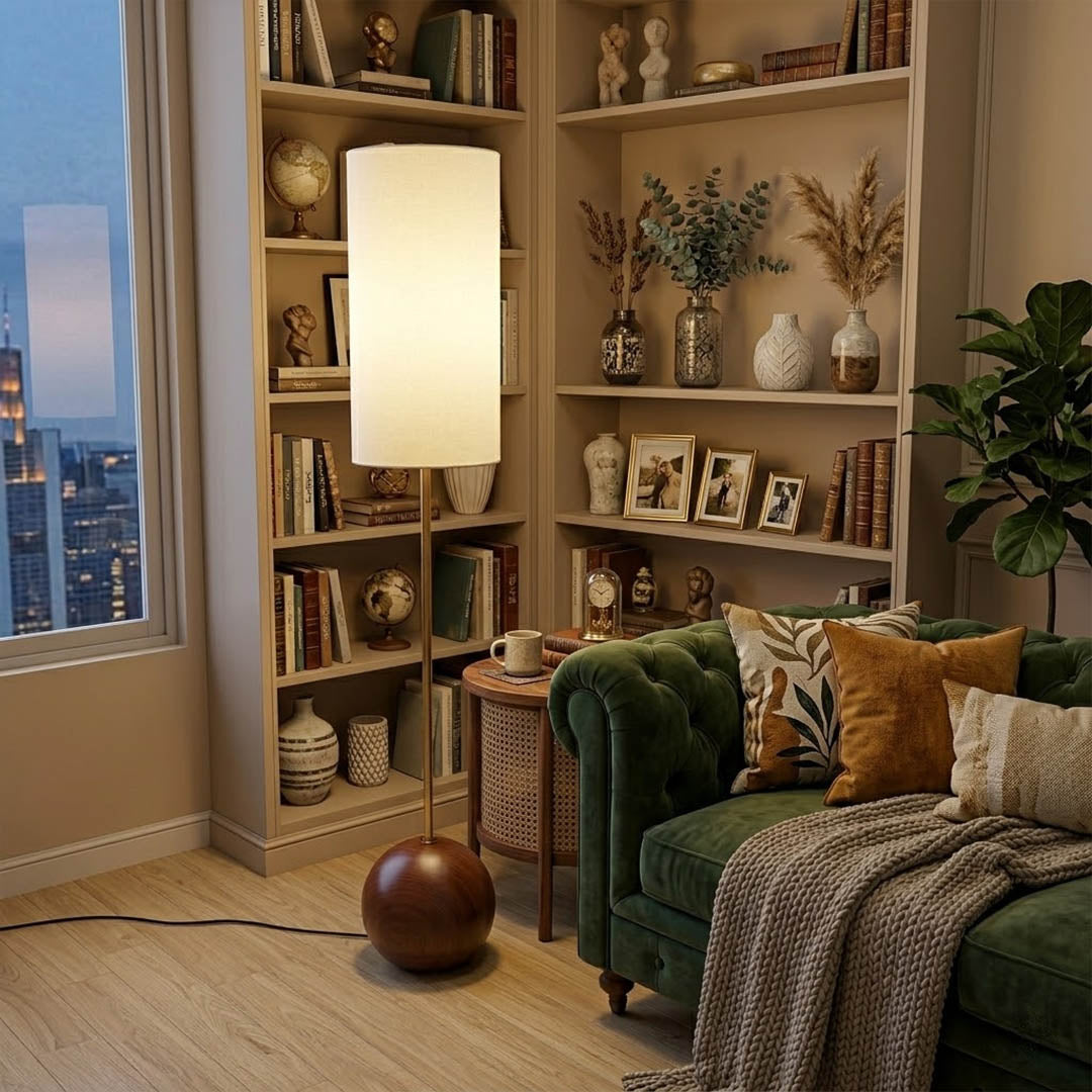 Senja wood floor lamp beside reading chair living room warm glow scandinavian interior
