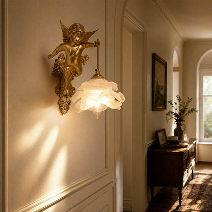 Serafino wall sconce illuminated soft warm glow evening powder room vanity mirror cozy romantic intimate mood brass angel American home lifestyle interior