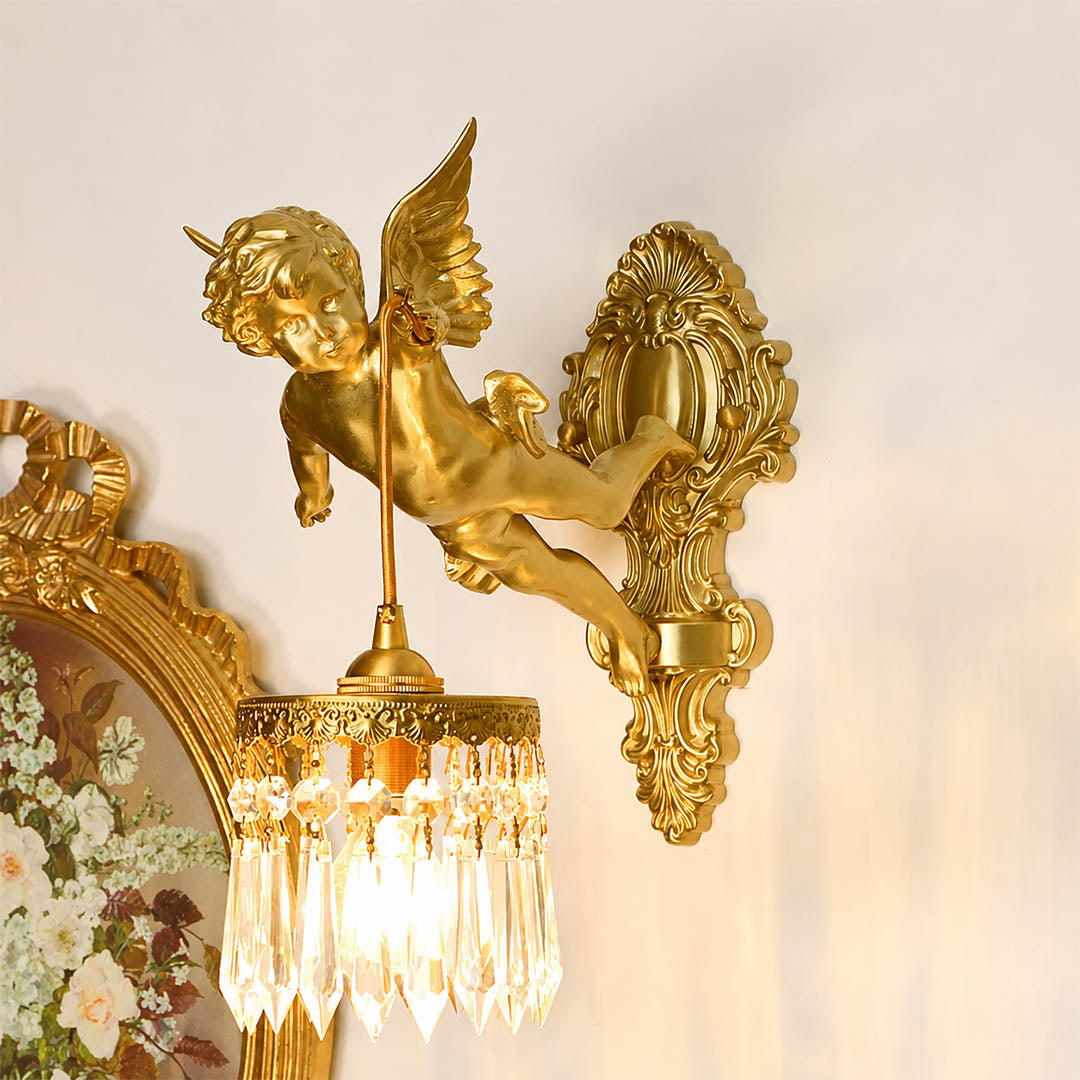 Serafino wall sconce brass finish angel living room feature wall beside framed portrait vintage baroque warm American home lifestyle interior
