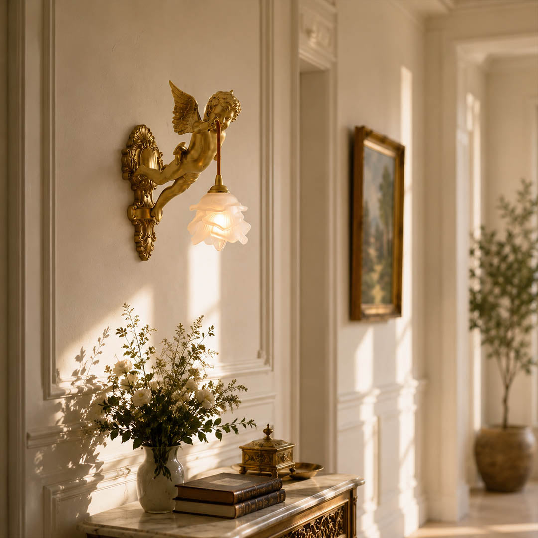 Serafino wall sconce brass finish angel living room feature wall beside framed portrait vintage baroque warm American home lifestyle interior