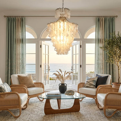 Serena Gold double tier Capiz shell chandelier grand dining room large table 10 seater Coastal mansion warm pearl glow lifestyle interior