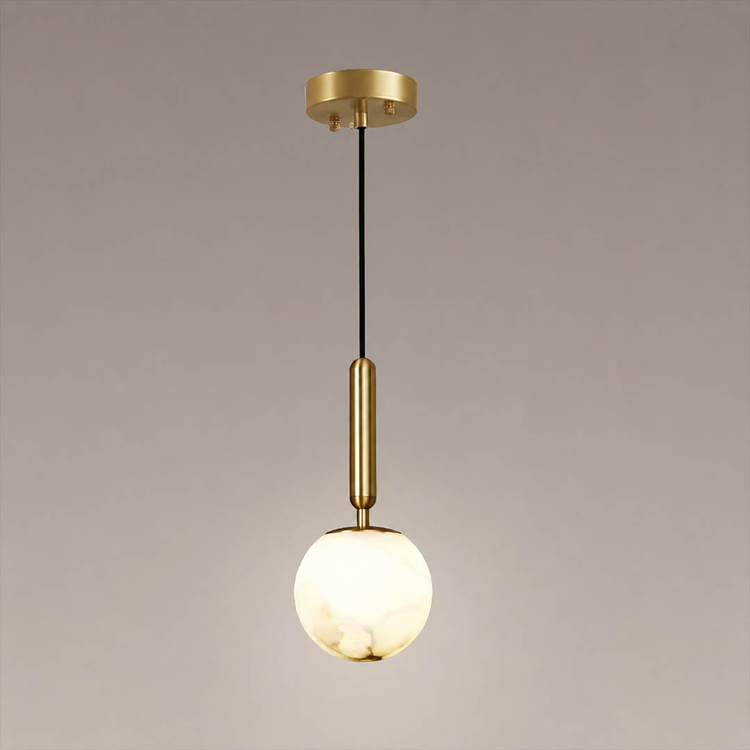 Sfera alabaster globe pendant light small single natural stone sphere brass stem black cord white background front view