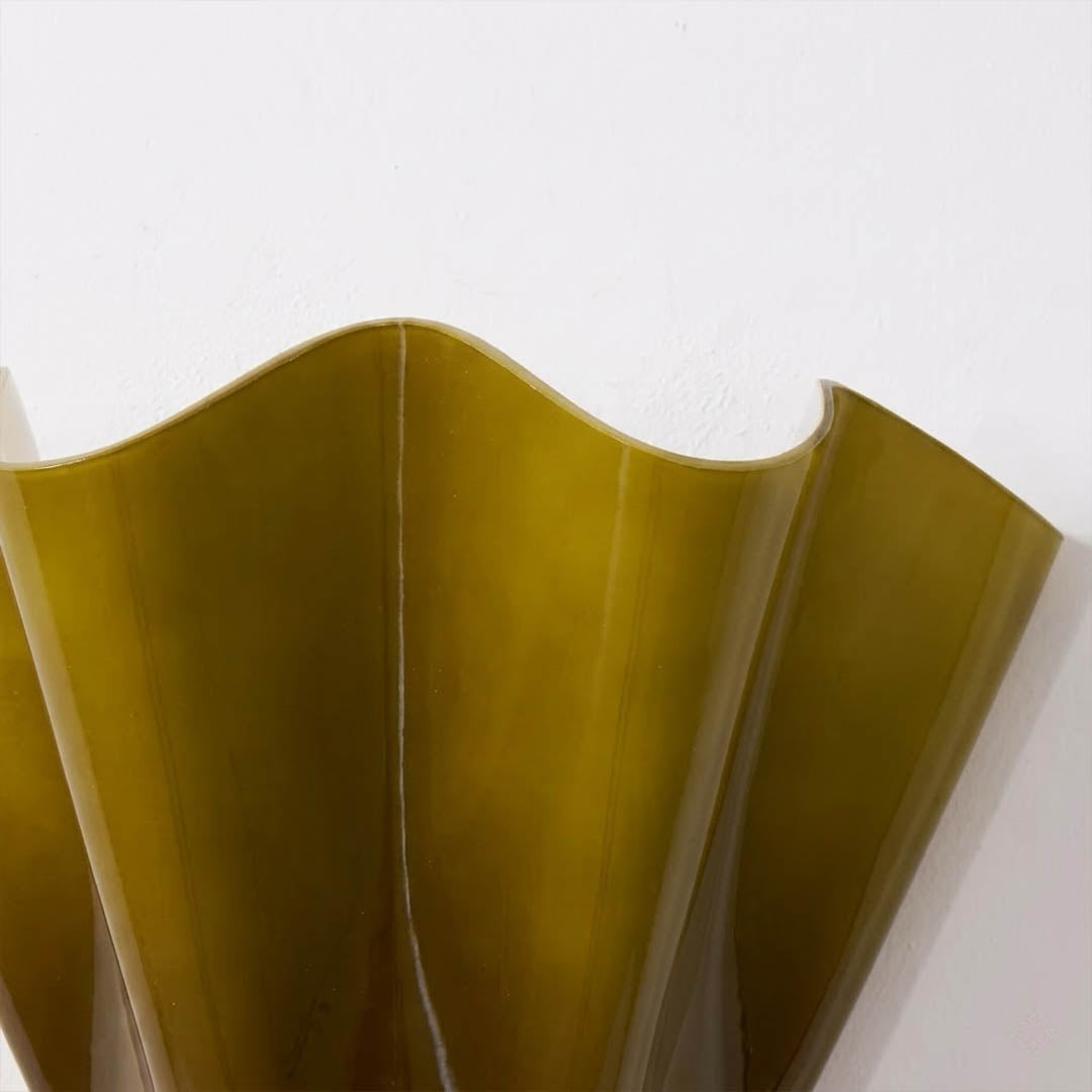 Shellie tinted glass shell curve close up light refraction tide pool effect amber glow water like illumination detail