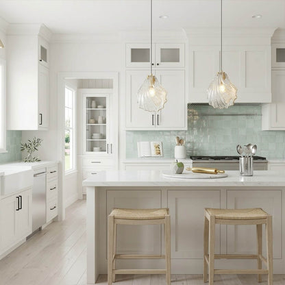 Shellie clear coastal pendant pair above kitchen island breakfast bar crystalline glass brass coastal modern interior