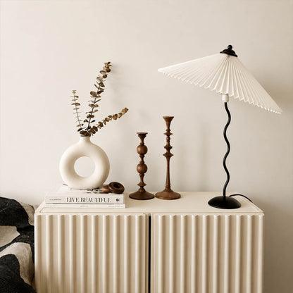 Sinuo table lamp black beige modern primary bedroom bedside nightstands pair sculptural squiggle wavy metal fabric drum shade postmodern Memphis inspired warm ambient intimate lifestyle interior