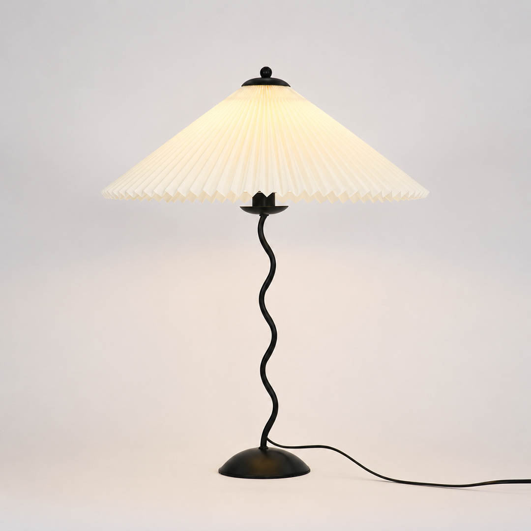 Sinuo table lamp modern sculptural squiggle wavy black metal base beige fabric drum shade 17 inch wide 23.6 inch tall E14 postmodern Memphis inspired statement bedside white background