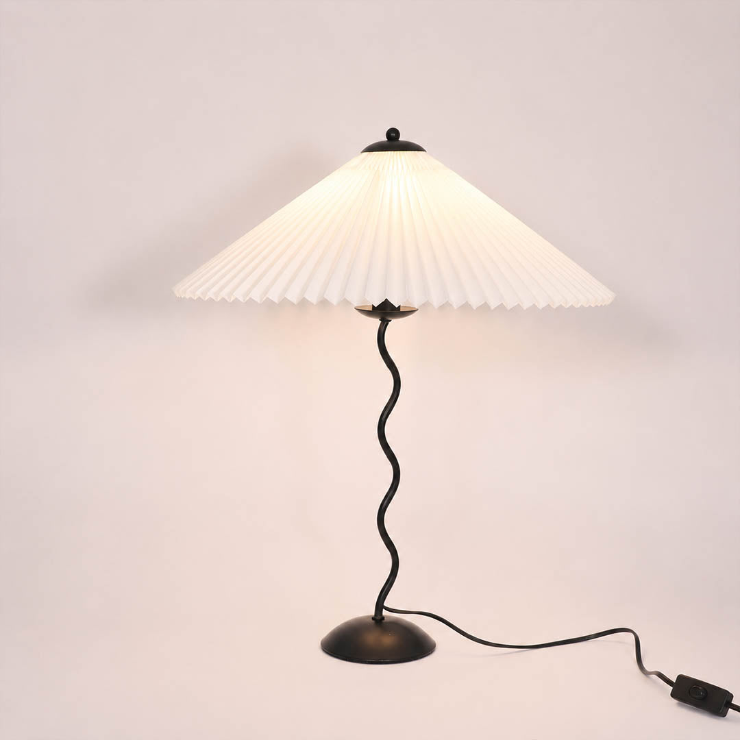 Sinuo table lamp modern sculptural squiggle wavy black metal base white fabric drum shade 17 inch wide 23.6 inch tall E14 postmodern Memphis inspired minimalist statement bedside white background