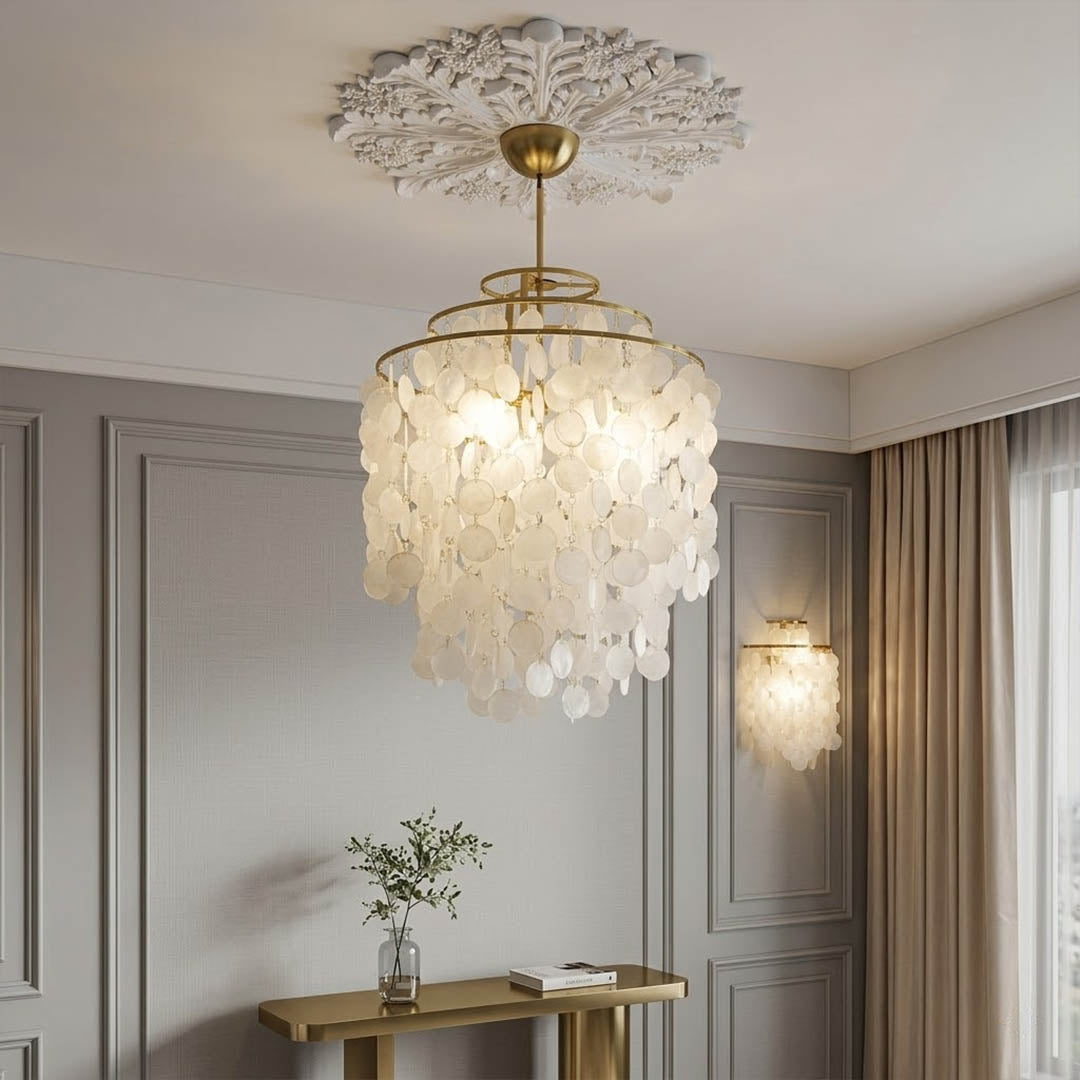 Sirena Gold FUN style shell disc pendant coastal living room beach house Hampton white wood natural shells warm glow lifestyle interior