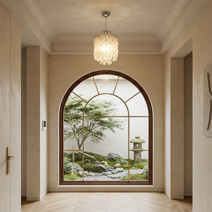 Sirena Gold FUN style shell disc pendant beach house foyer entryway coastal Mid Century designer Hampton welcoming warm glow lifestyle