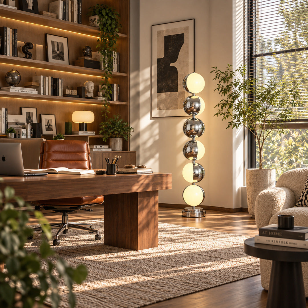 Slancio chrome floor lamp adding a sleek modern accent to a home office corner