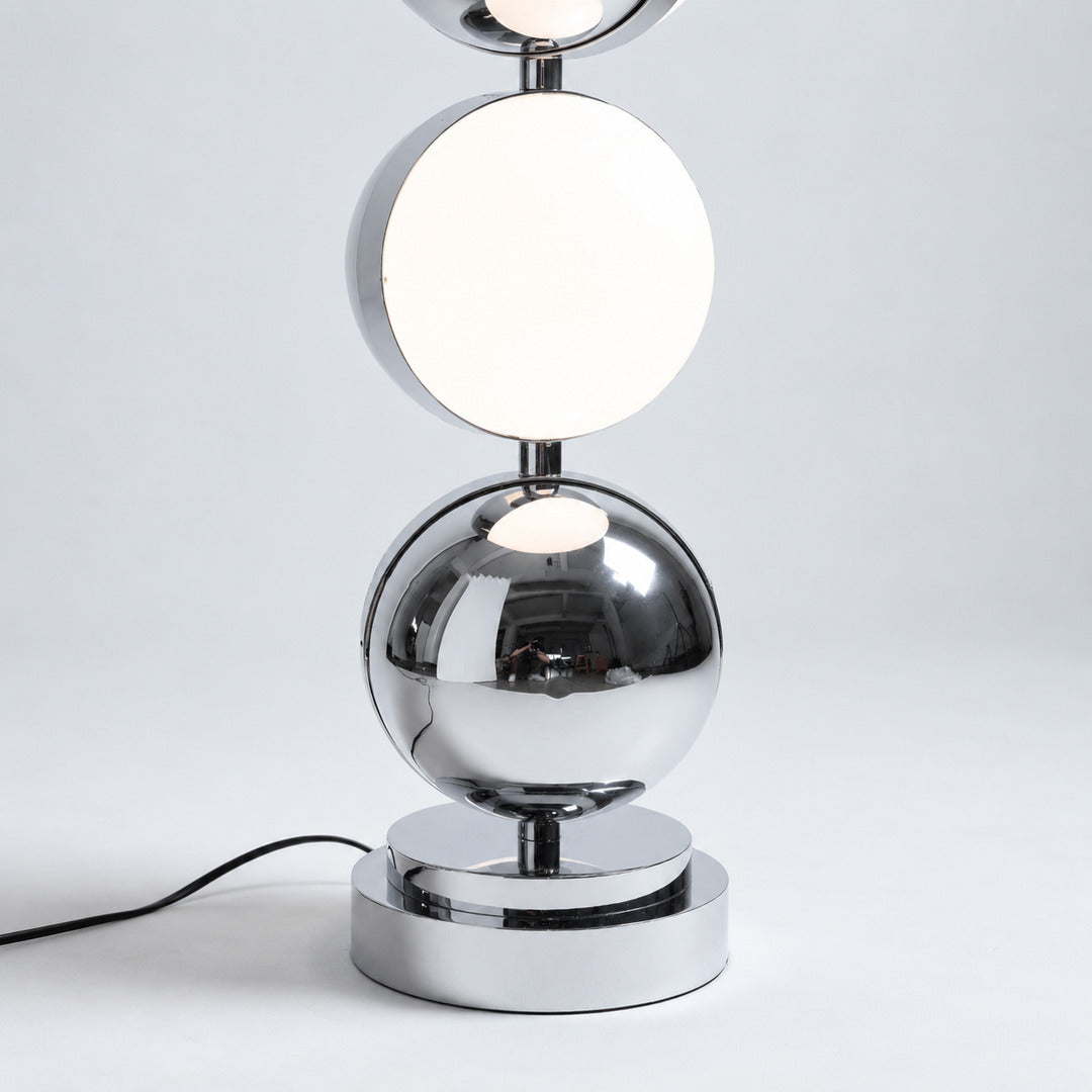 Soft warm glow diffusing from the acrylic head of the Slancio chrome floor lamp