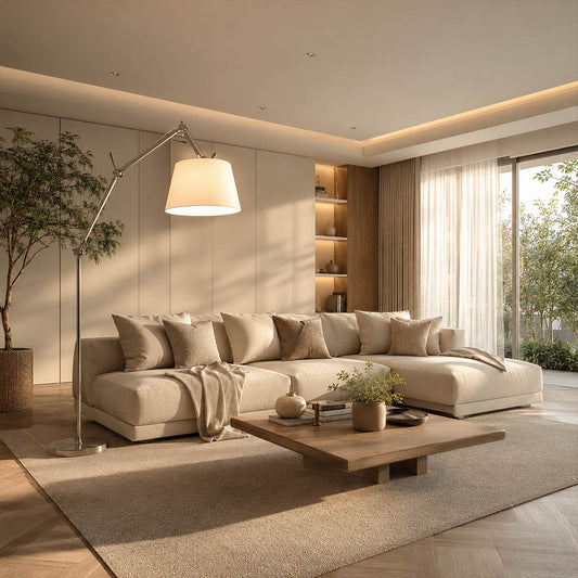 The 95.7-inch Snodo floor lamp arcing over the back of a sofa in an American living room, delivering direct reading light without a side table
