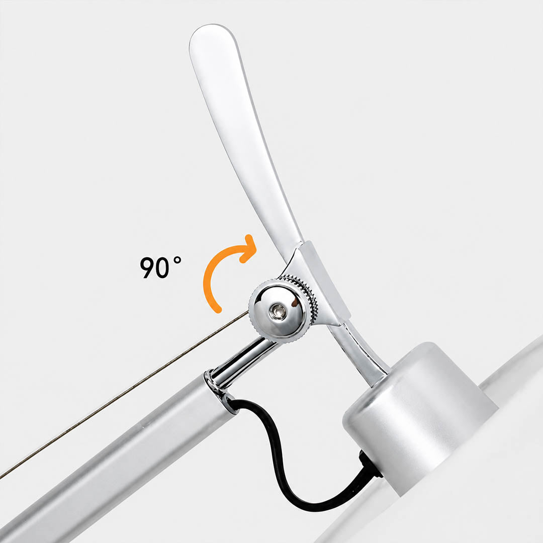 Close-up of the Snodo floor lamp swing-arm joint showing the adjustable pivot connection