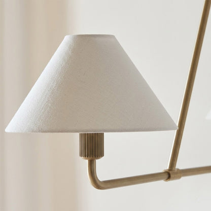 Sola black angular chandelier above dining table warm fabric drum shade light japandi interior