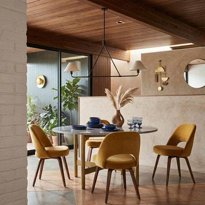 Sola black angular chandelier above dining table warm fabric drum shade light japandi interior