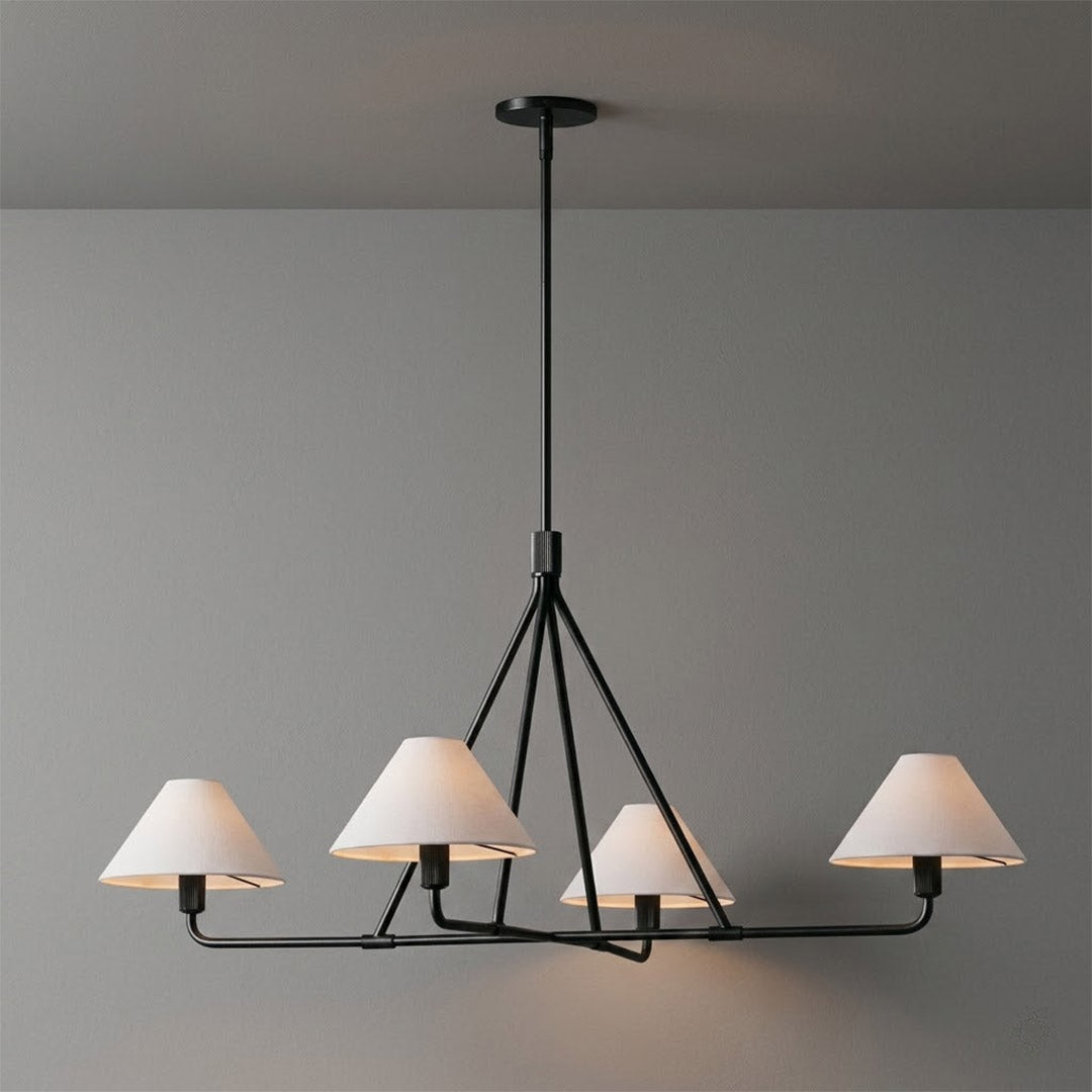 Sola black angular chandelier above dining table warm fabric drum shade light japandi interior