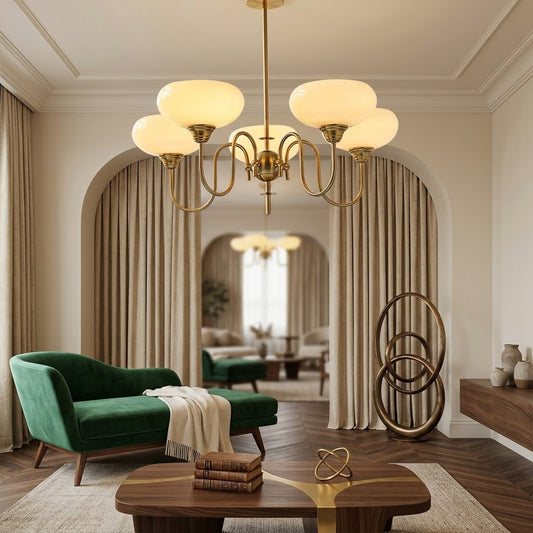 Solari cream glass chandelier above dining table warm amber gold light organic modern interior