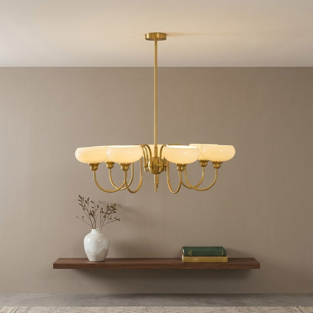 Solari cream glass chandelier above dining table warm amber gold light organic modern interior