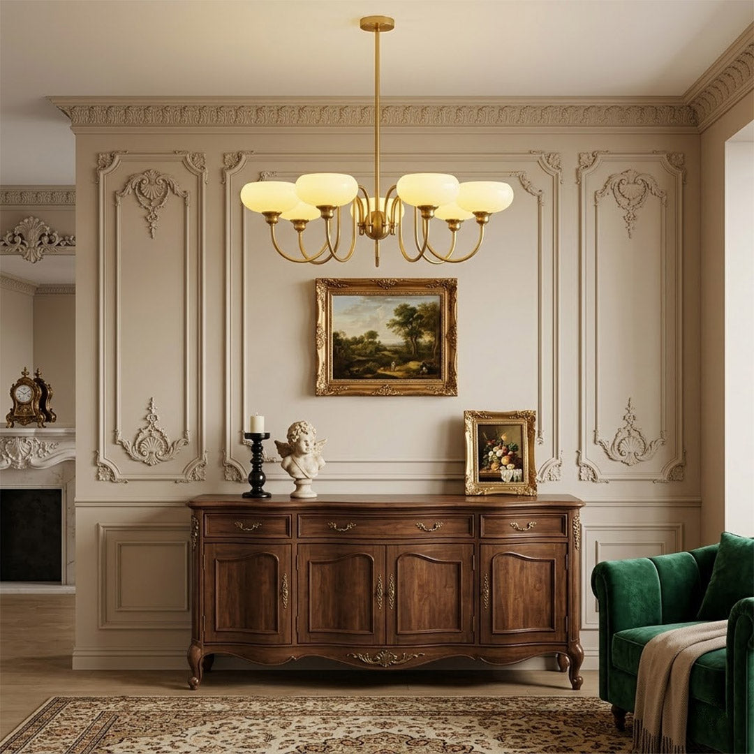 Solari cream glass chandelier above dining table warm amber gold light organic modern interior