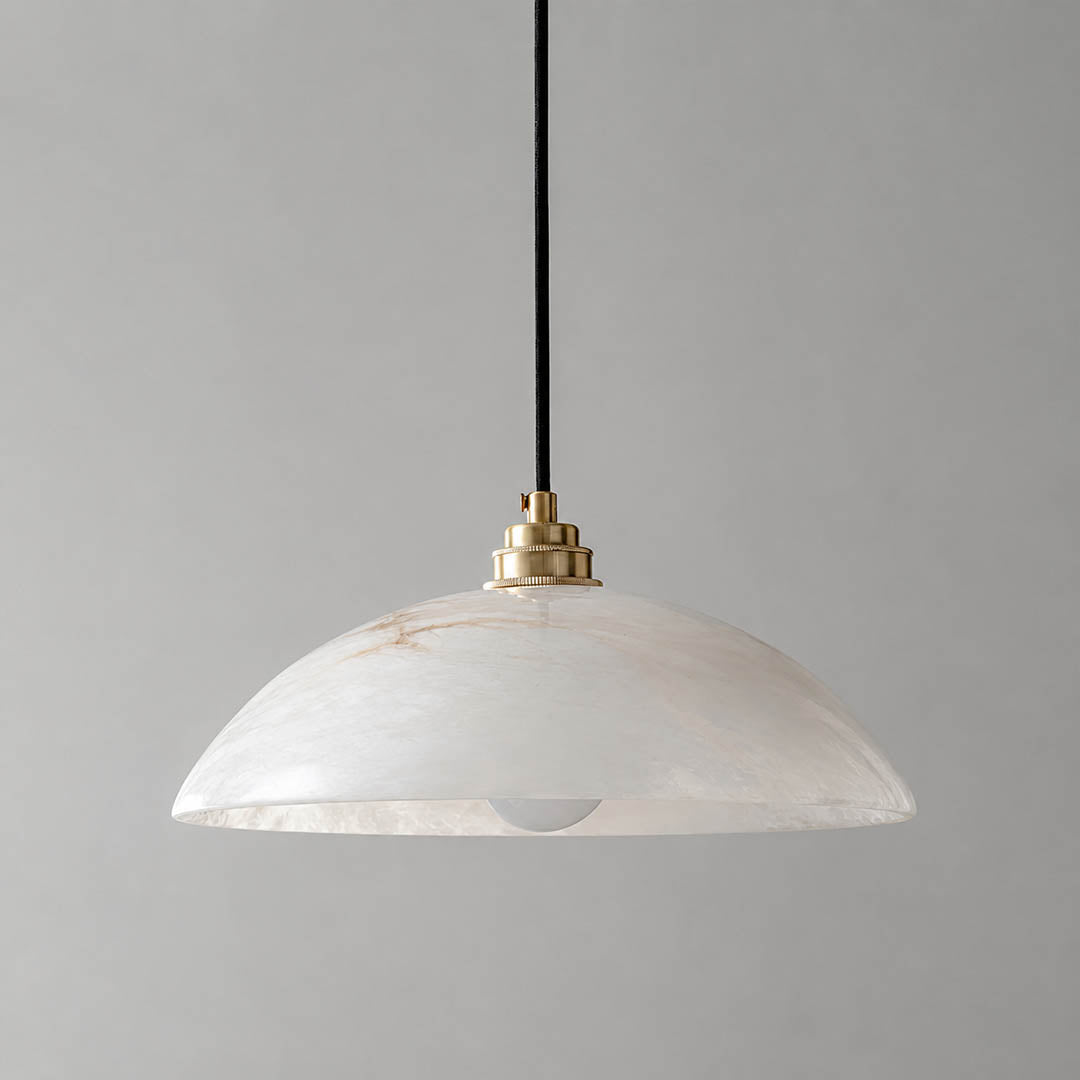 Sole alabaster pendant light illuminated warm glow translucent stone veining soft glare free radiance white background