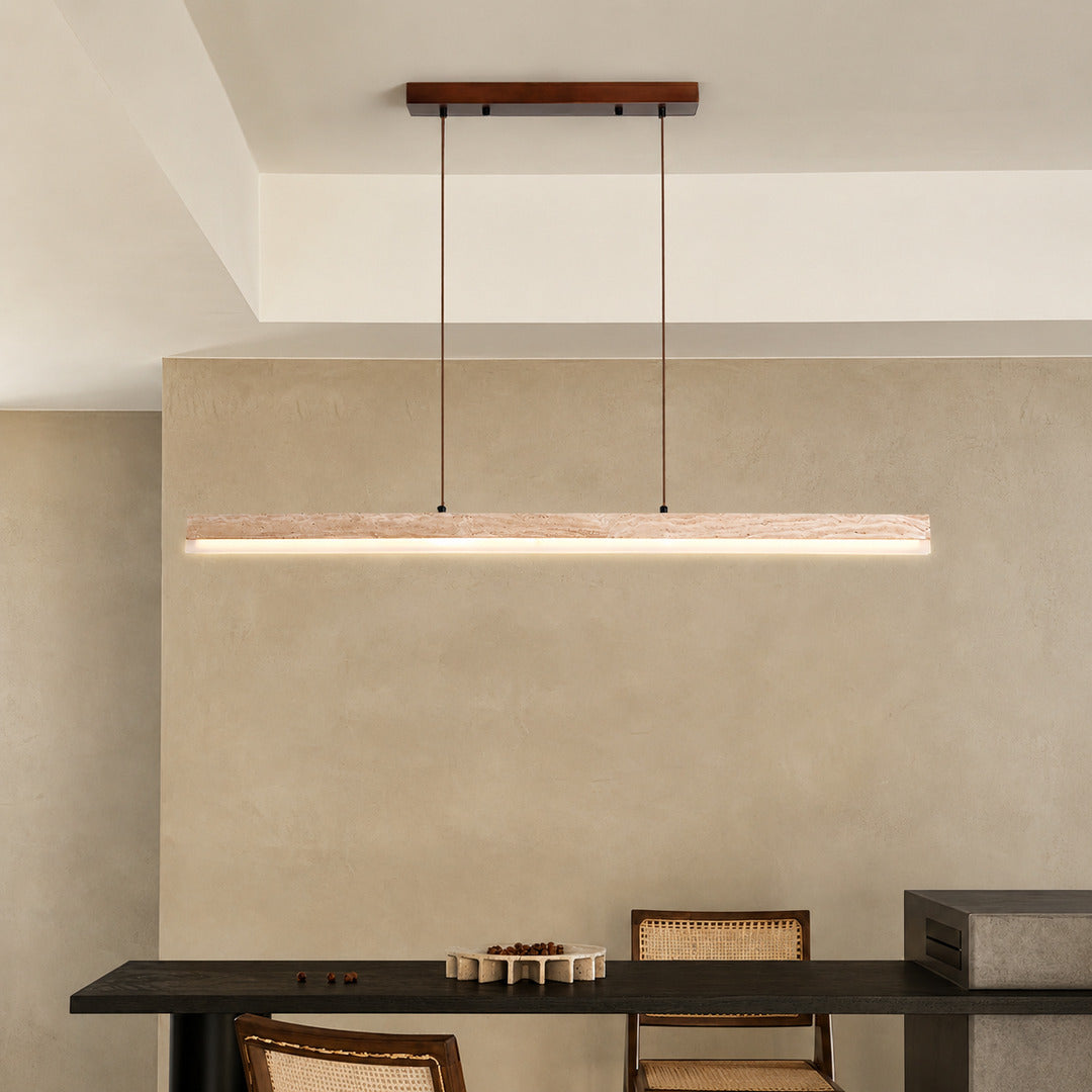 Sole travertine pendant light large dining table oversized warm glow natural travertine stone disc statement American home lifestyle interior styled