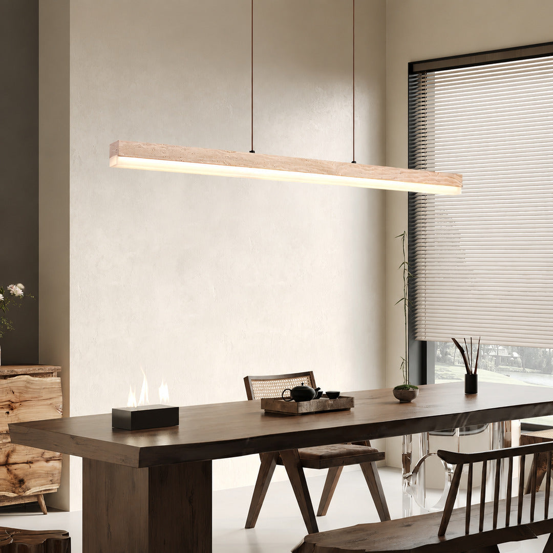 Sole travertine pendant light large dining table oversized warm glow natural travertine stone disc statement American home lifestyle interior styled
